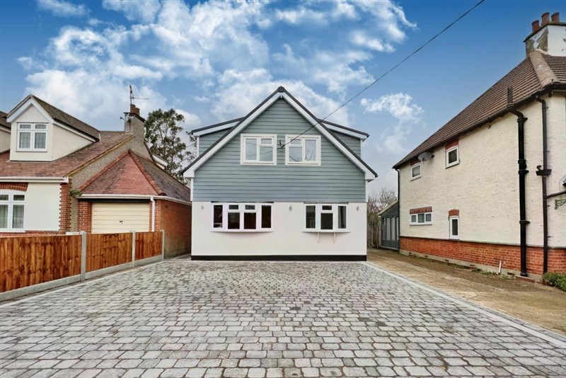 Front exterior and paved driveway