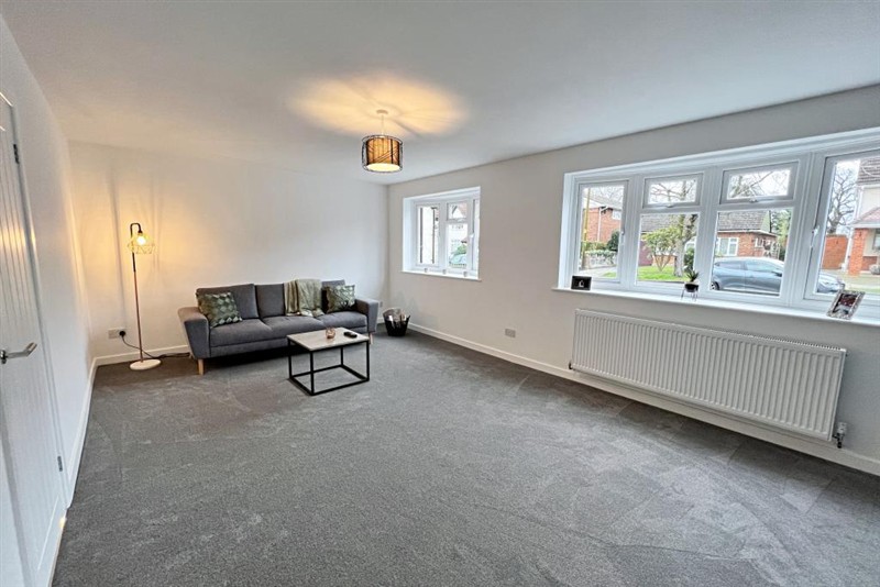 Living room with garden-facing windows