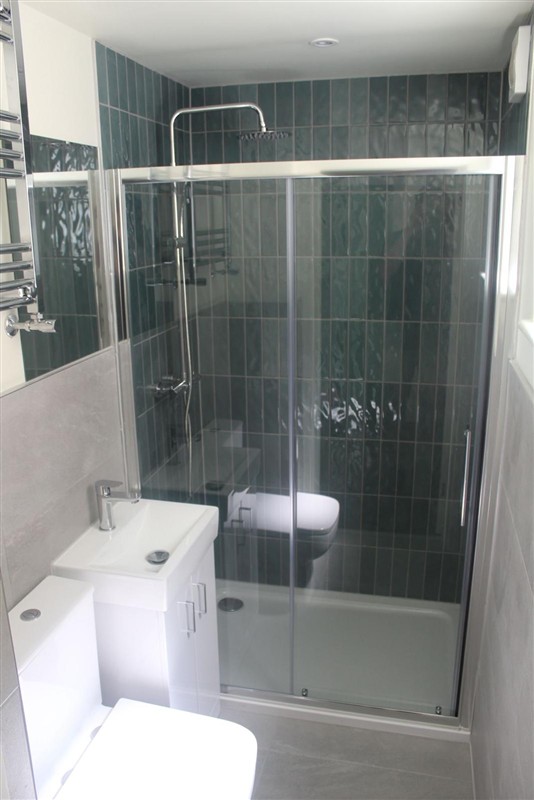 Glazed shower enclosure