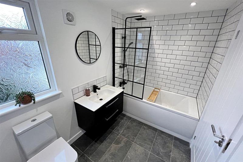Bathroom basin and tiled walls
